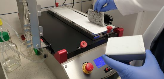 Figure 4. Coating undergoing ASTM D4213 testing with reversing abrasive pad shown.jpg