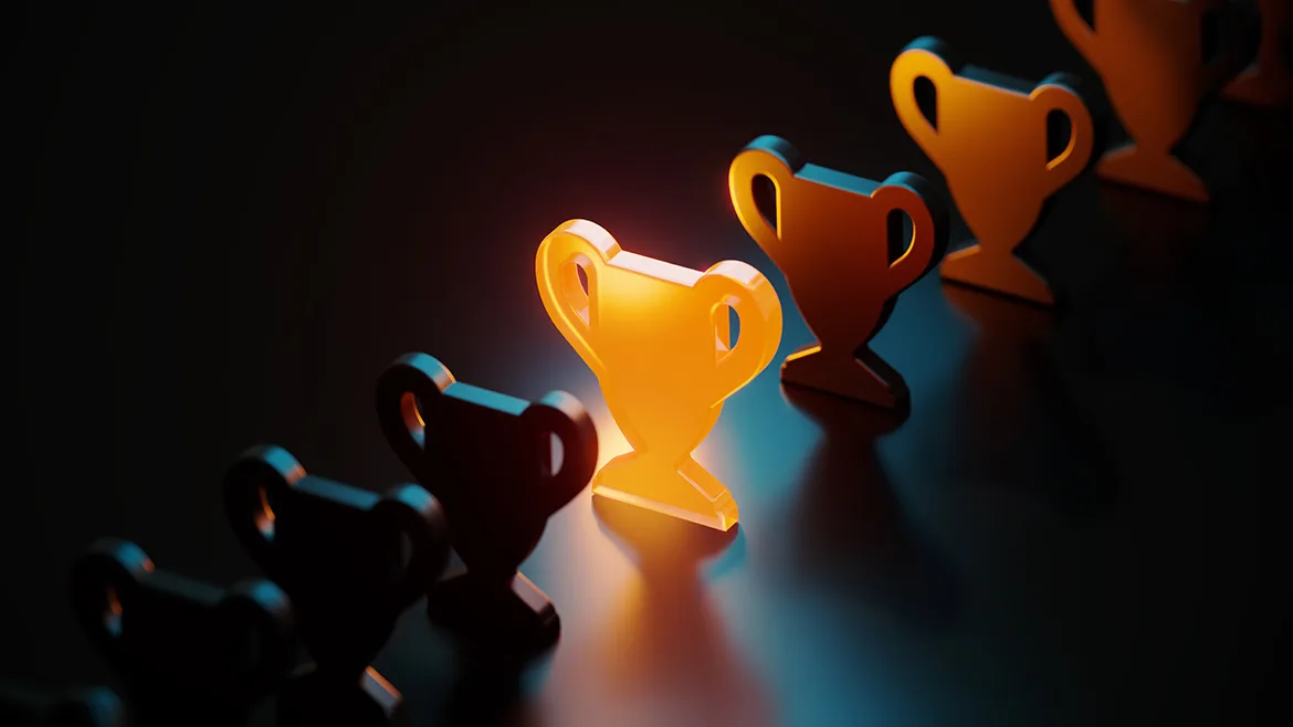 Default Award Image Trophy symbol glowing amid black trophy symbols on black background