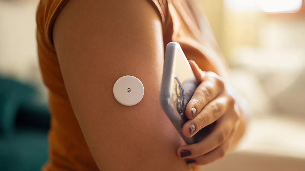 Woman monitoring glucose level