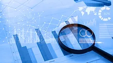 default market report Magnifying glass and documents with analytics data lying on tablet