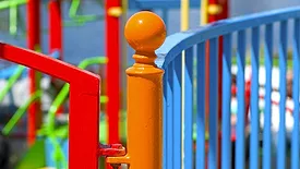 Colorfully painted fence around a playground