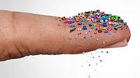 GI-2191690543-1170x658.jpg Microplastics plastic particles on an index finger