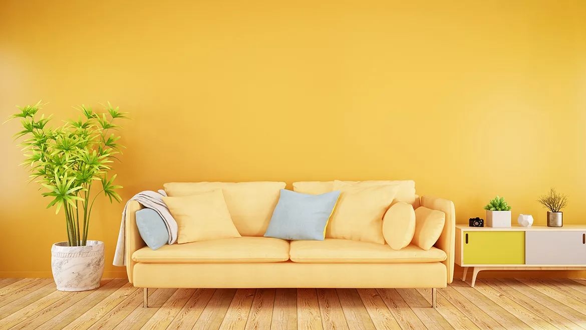Yellow living room with sofa and plants
