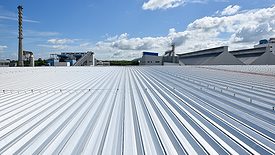 Roofing and lightning faraday systemon installed on new warehouse with exsiting old building warehouse and blue sky background