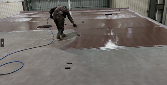 Applying Stelpant to the fabricated steel during the Min Hua 16 building phase