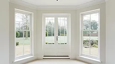 White bay windows and French doors