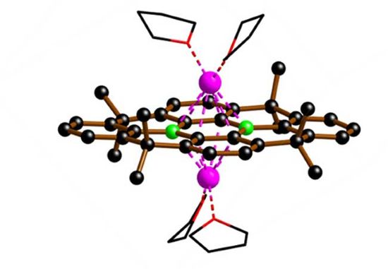 Two boron atoms, shown in green, are embedded in a carbon framework, shown in black.