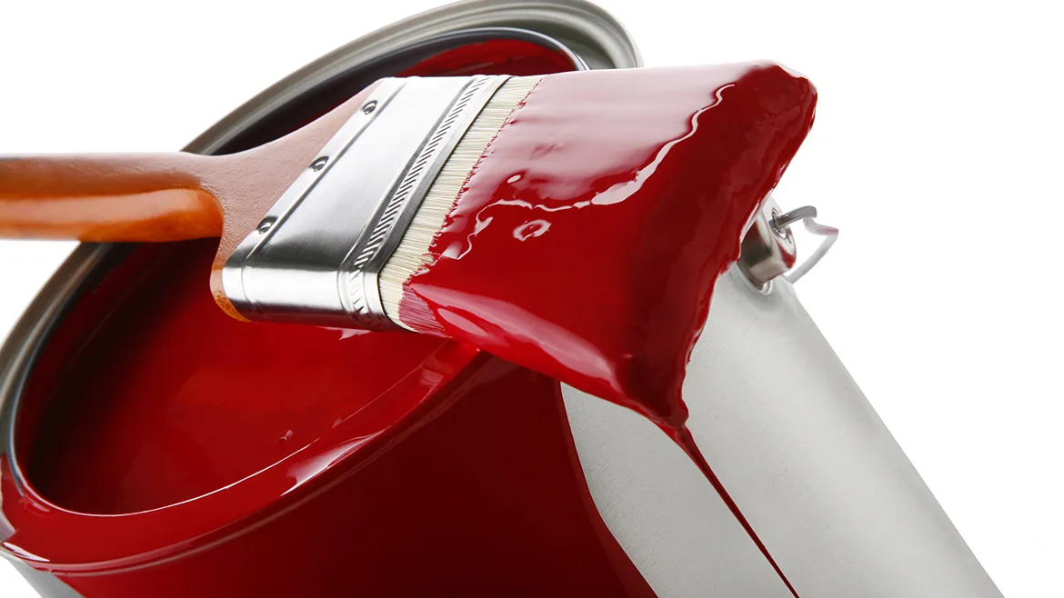 GI-123493105-1170x658.jpg Thick red paint on brush sitting on paint can