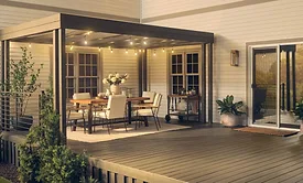 With Cabot®, shades such as Burnt Hickory (pictured  left) enhance porches, decks and exterior wood seating which  support casual fall routines and everyday connection. 
