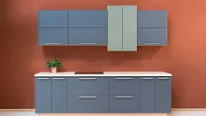 Modern kitchen with rust-colored walls and slate-colored cabinets