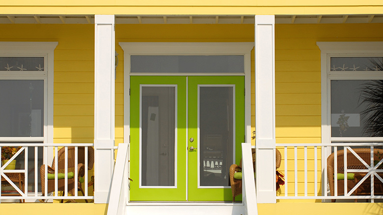 yellow house exterior with green door