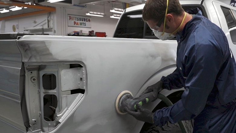 Illustrating the proper sanding technique for primer surfacer to ensure uniform surface preparation and reliable repair performance