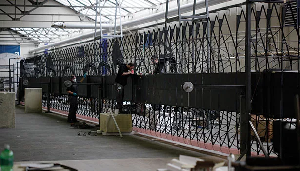 men work on wing carbon structure