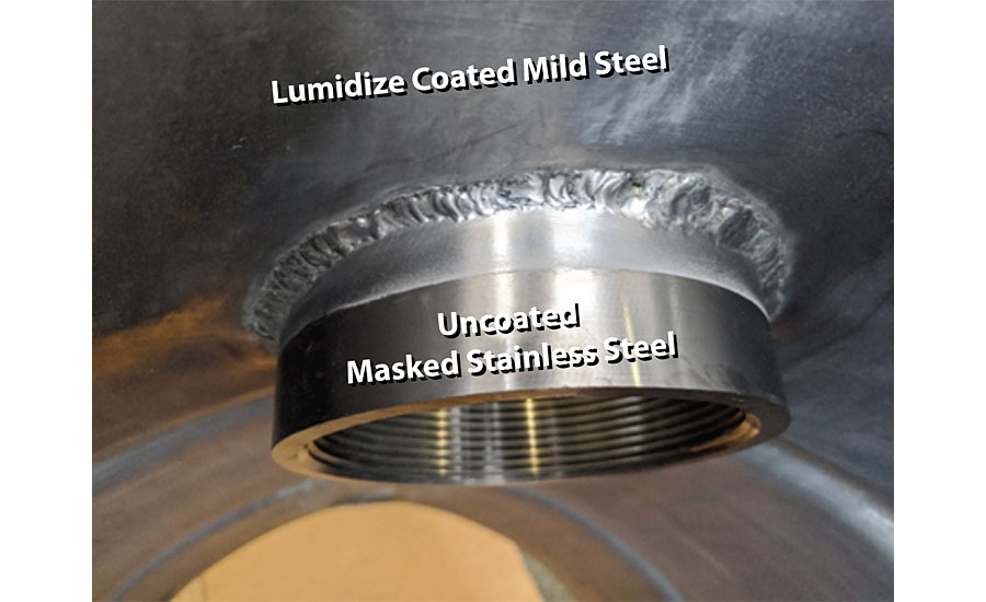 Lumidize applied to a multi-metal part as part of commercial demo. Stainless steel fitting partially masked but shows Lumidize coating on unmasked section, weld site and mild steel area.