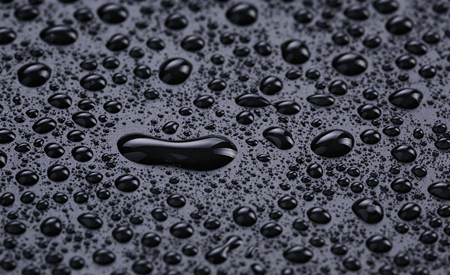 Example of water beading on a hydrophobic surface.