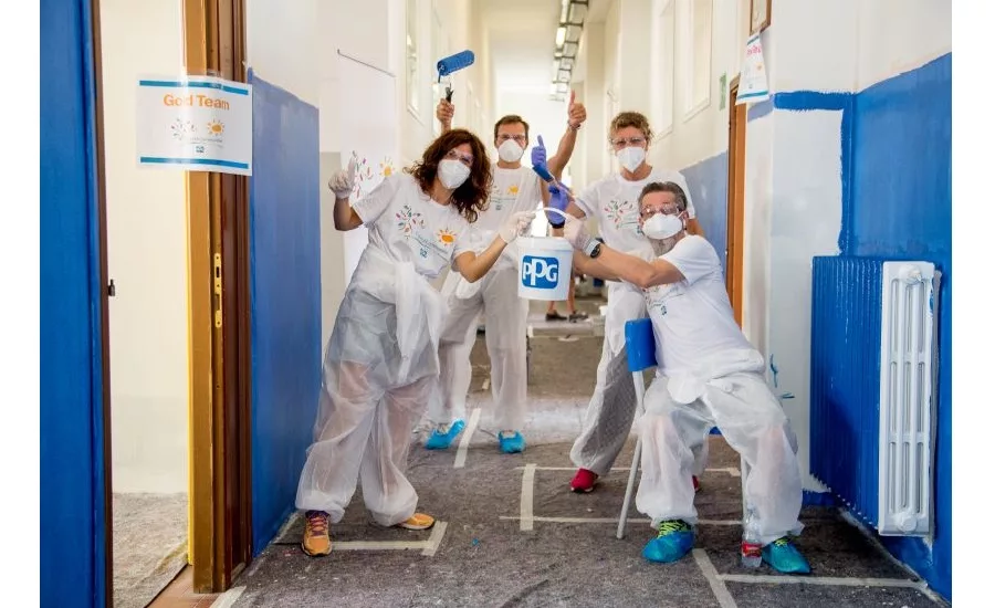 image of volunteers painting in a hallway