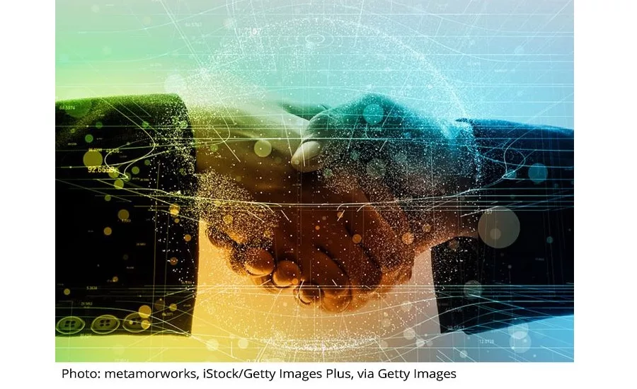 two hands shake with data overtop