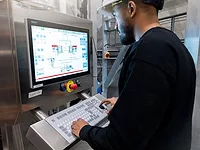 factory worker at computer station