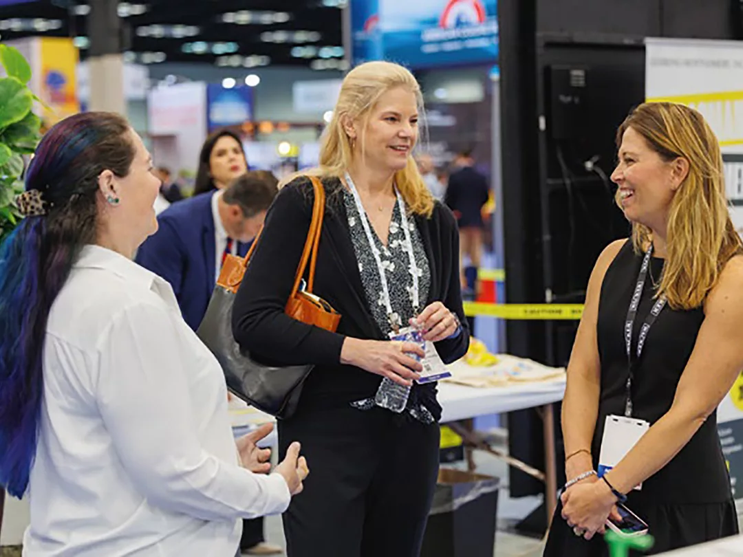 PCI Editor Kristin Johansson meets with Wacker Chemical Corp.'s Diane Merzbach (left) and Rachel Ufer (right). Photo courtesy of the AC Show Daily.