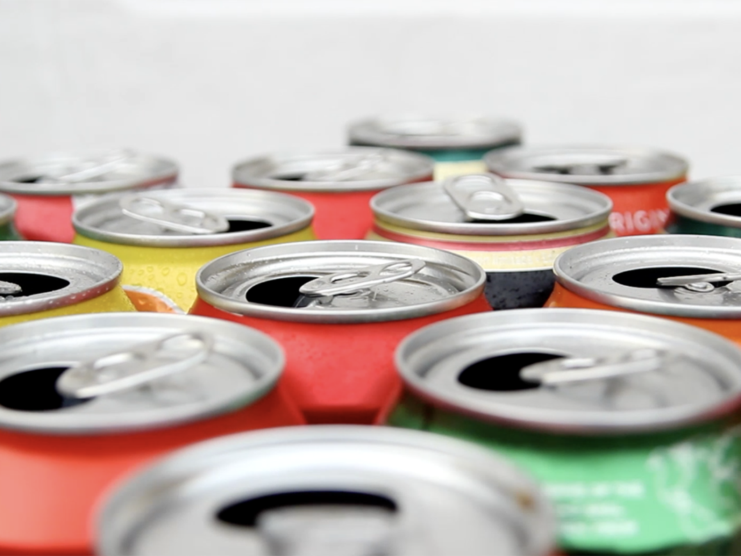 close up of open aluminum soda cans