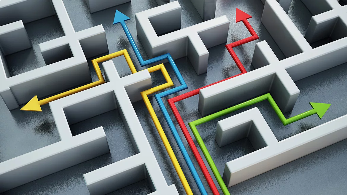 Yellow, blue, red and green lines with arrows leading through different ways in a maze