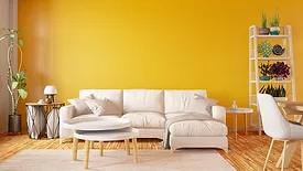 Modern interior design sofa with yellow painted wall