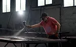 man woodworking in workshop