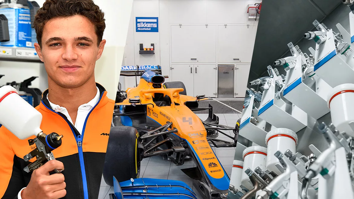 Photo of man holding spray painting equipment and a racing car