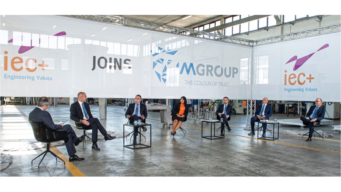 Photo of IM Group and IEC+ executives announcing merger