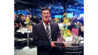 Photo of Fernando Itaziki with the award for Industrial Tinting Equipment Systems in Brazil.