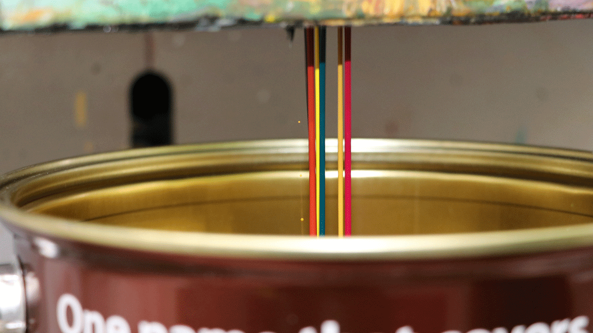 Photo of colorant being added to a can of HMG base paint