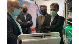 Image of PPG executives with a MoonWalk automotive refinish mixing system.