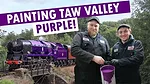 Photo of painters in front of the Taw Valley train