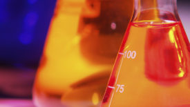 Image of laboratory flask with orange liquid.